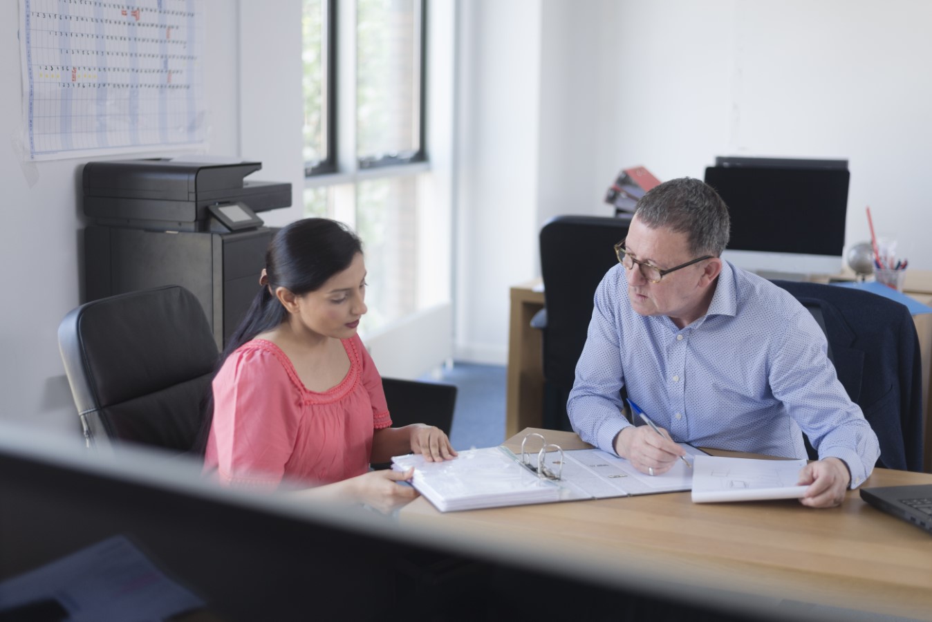 People Reviewing Paperwork